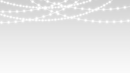 Garland hanging festive ribbons and glowing bulbs for christmas holiday decoration banner stage.
