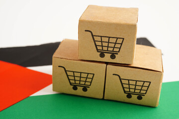 Online shopping, Shopping cart box on Sudan flag, import export, finance commerce.