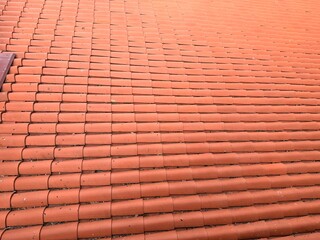 A background of natural orange roof tiles, showcasing an excellent example of masterful craftsmanship.