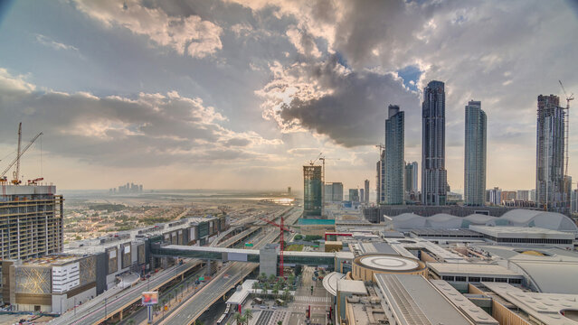 Sunrise aerial view of Financial center road morning timelapse with under construction building