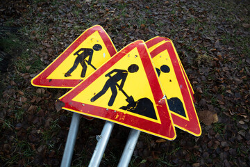 men at work signs on ground