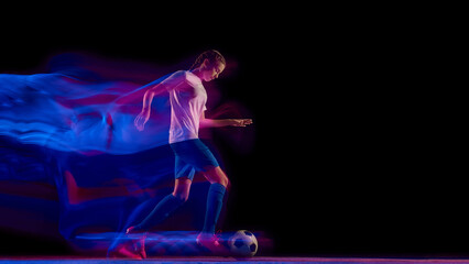 Female soccer player running with ball in neon motion blur. Concept of speed training visuals, sportswear product campaigns, fitness advertising, and coaching education content.