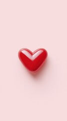 Fototapeta premium Bright crimson heart with gloss shine, Glossy scarlet heart against gentle pastel background, Lustrous crimson heart set on delicate pink surface emphasizing passion and intimacy symbol