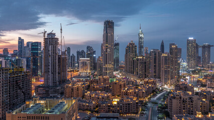 Obraz premium Dubai Downtown skyline during sunset timelapse with modern towers panoramic view from the top in Dubai