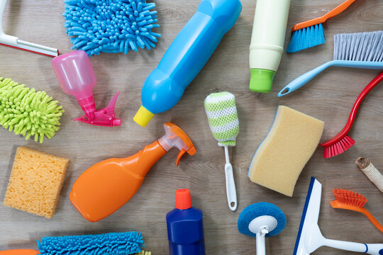 House cleaning plastic product on wooden table background, home service or housekeeping concept