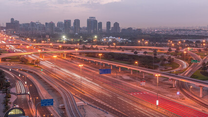 Obraz premium Aerial top view to Sheikh Zayed road near Dubai Marina and JLT night to day timelapse, Dubai.