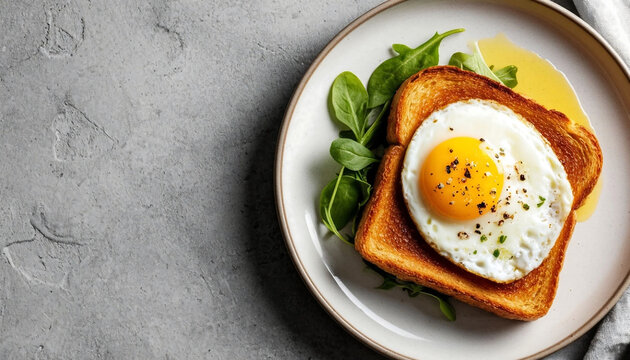 Sunny side up egg on tomato toast with fresh basil captures a vibrant breakfast delight, featuring a runny golden yolk over red sauce on crusty bread, garnished with green leaves on a white plate agai