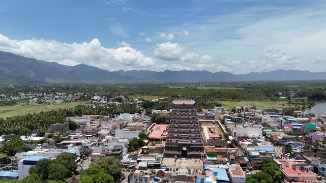 Aerial view of Tenkasi town with the grand Kasi Viswanathar Temple in the center, nestled among lush greenery and scenic mountains in Tamil Nadu.