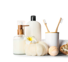 Bath accessories and flower on white background