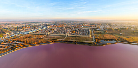 Aerial view of the medieval city of Aigues-Mortes at sunrise, in the Gard department, Occitanie region, France