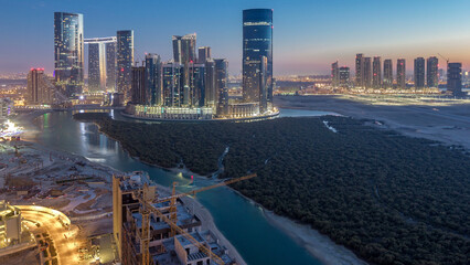 Buildings on Al Reem island in Abu Dhabi day to night timelapse from above. © HyperlapsePro