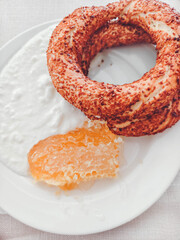 Yogurt, buns and honey. Tasty and healthy breakfast.