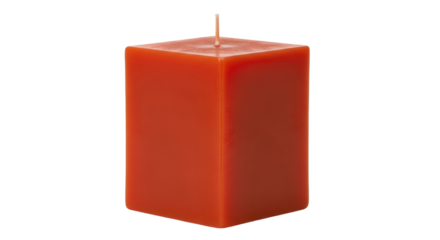 Isolated orange wax candle in block shape for decoration at home or in interior design