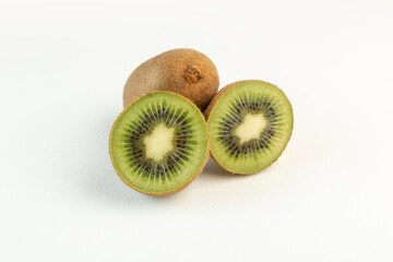 brown sour kiwis sliced lined isolated on the white desk