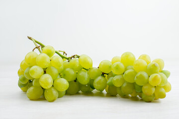 a front view fresh green grapes juicy and sour on the white desk fruit color vitamine summer