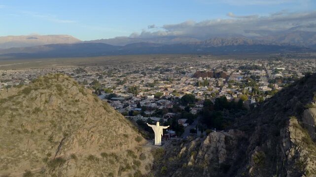 Aerial view of Cristo del Portezuelo overlooking the city of Chilecito and surrounding mountains.