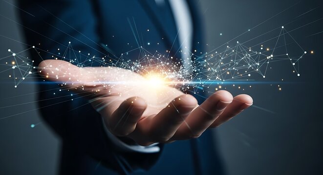 Hand holding glowing network of connected dots representing technology and innovation concept