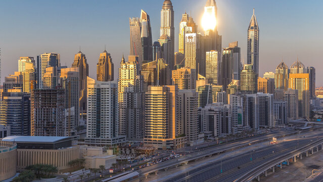 Dubai Marina towers during sunset aerial timelapse, United Arab Emirates