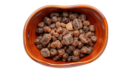 Isolated caramel candy pieces in bowl, small to medium size, sweet dessert confectionery