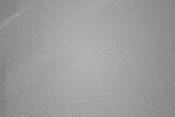 Grey abstract grainy texture background with speckled noise effect