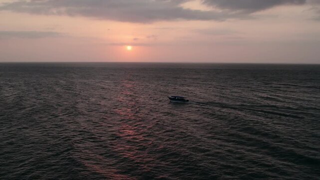 Boat riding an amazon river in amazon rainforest on sunset