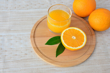 Fresh Orange Juice and Oranges on a Wooden Board flat lay