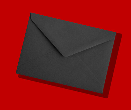 Black envelope with a letter inside. Premium stationery for mail, invitation, correspondence, or