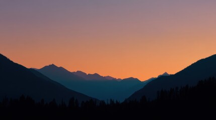 Obraz premium Serene Mountain Landscape at Dusk with Vibrant Sunset Colors and Silhouettes of Peaks Under a Gradient Sky