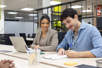 Business colleagues collaborating working together during meeting
