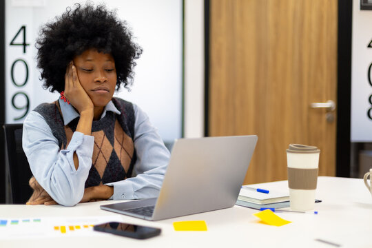 Tired african american woman feeling burnt out researching - Powered by Adobe