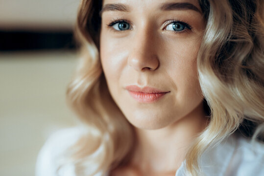blonde bride in a tight wedding dress in a studio