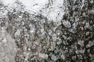 Hard water Calcium or lime scale deposit stains on a shower glass window. Close up, macro shot, no people