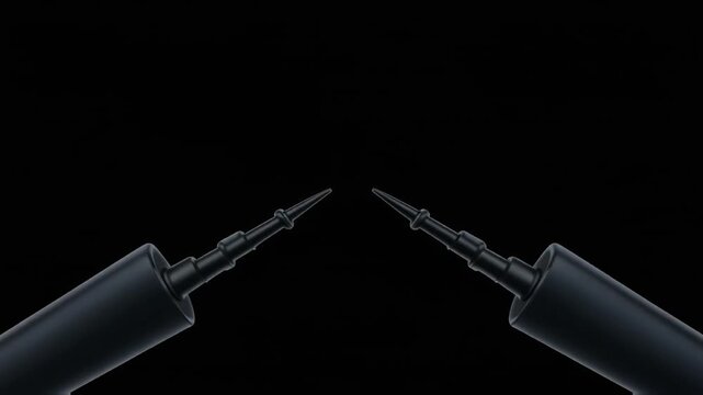 Symmetrical matte black mechanical probes angled inward almost touching tips in high contrast isolation.