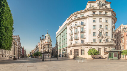 Street panoramic view of Constitucion avenue with historical buildings and trams timelapse