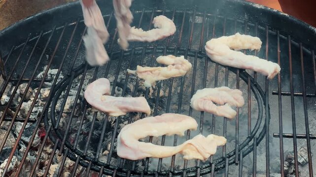 Grilled intestines to crispy texture. Chinchulin is the small intestine of an cow used in cooking, especially in Argentine, Uruguayan, and Paraguayan cuisine. High quality 4k footage