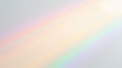Naklejka premium Beautiful spectrum of colors appears as rainbow on light background, creating serene and calming atmosphere