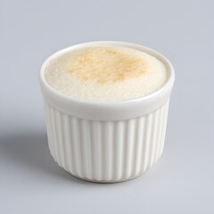 Classic Sweet White Souffl&eacute; Dessert in Fluted Ceramic Ramekin