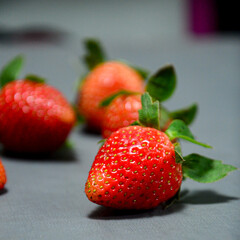 Close up photo of fresh strawberry isolated on gray background