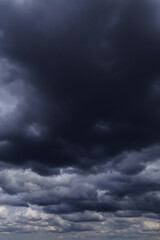 Fototapeta premium Epic Dramatic Storm sky with dark blue cumulus rainy clouds abstract background texture, thunderstorm