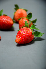 Close up photo of fresh strawberry isolated on gray background