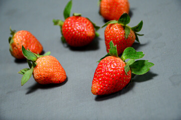 Close up photo of fresh strawberry isolated on gray background