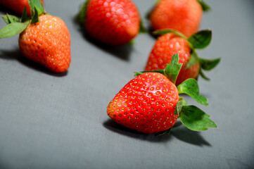 Close up photo of fresh strawberry isolated on gray background