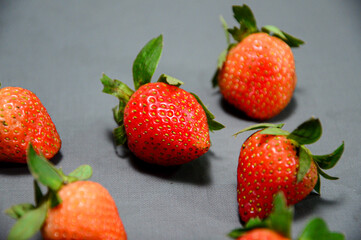 Close up photo of fresh strawberry isolated on gray background