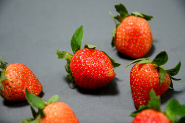 A photo of fresh strawberry on gray background 