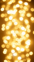 Obraz premium Blurred gold light orbs create a warm, glowing texture, representing celebration, festivity, and ethereal ambiance, suitable for festive backgrounds