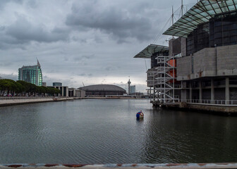 A view of the Parque das Nações in Lisbon, Portugal, with modern architecture and a body of water.