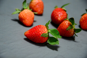 Fresh strawberry isolated on gray background 