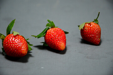 A photo of fresh strawberry on gray background 