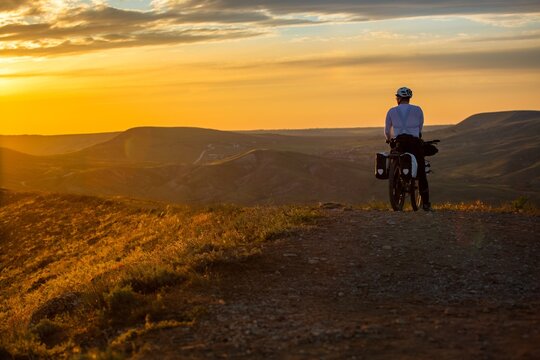Man travel cyclist riding bicycle hike in mountain on bike