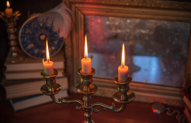 Mystical altar with candles, books, and divination stuff